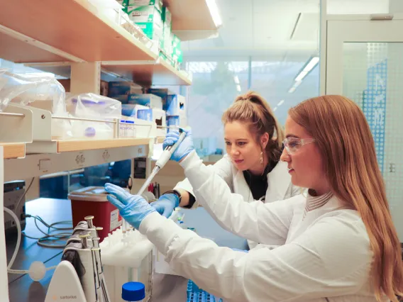 two women using lab equipment