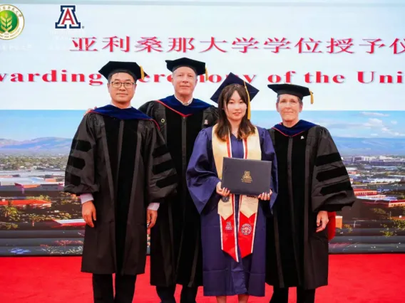 Photo of outstanding senior, Liu Siyu, with faculty