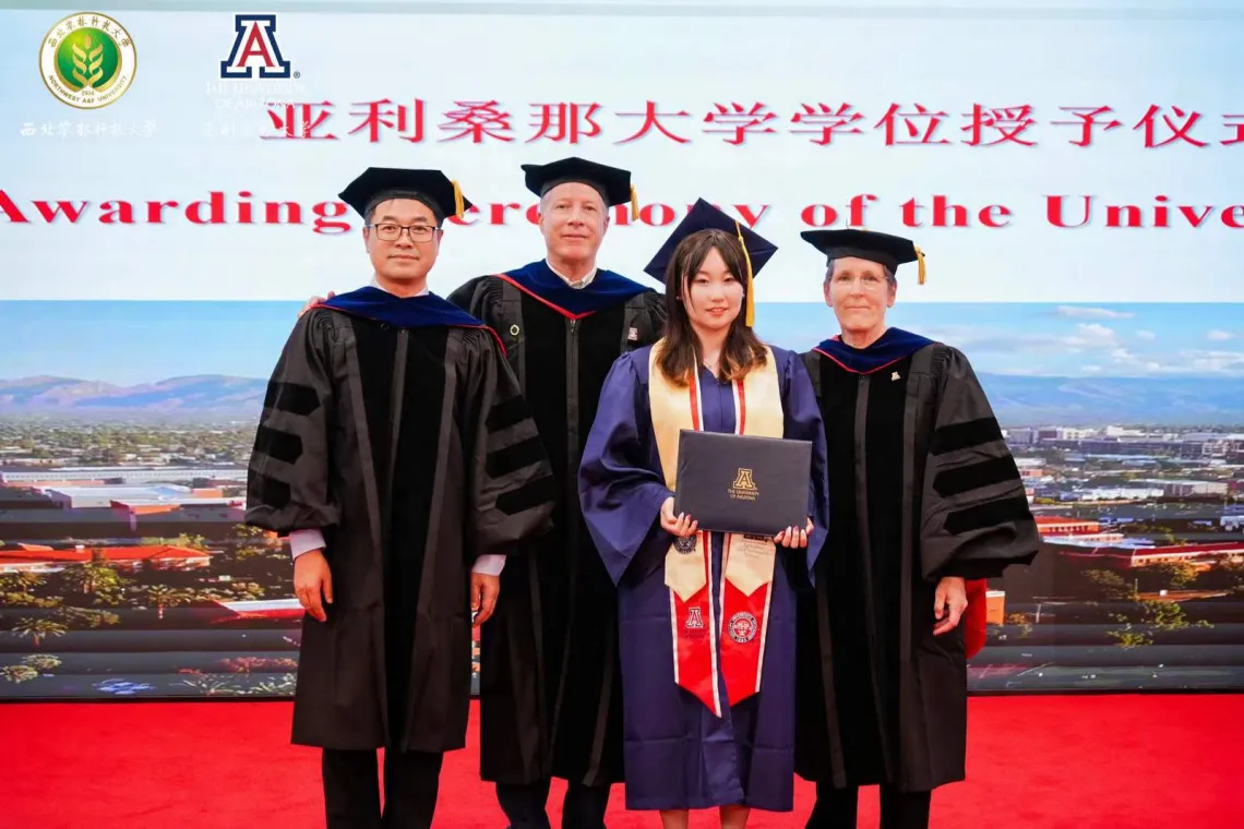 Photo of outstanding senior, Liu Siyu, with faculty